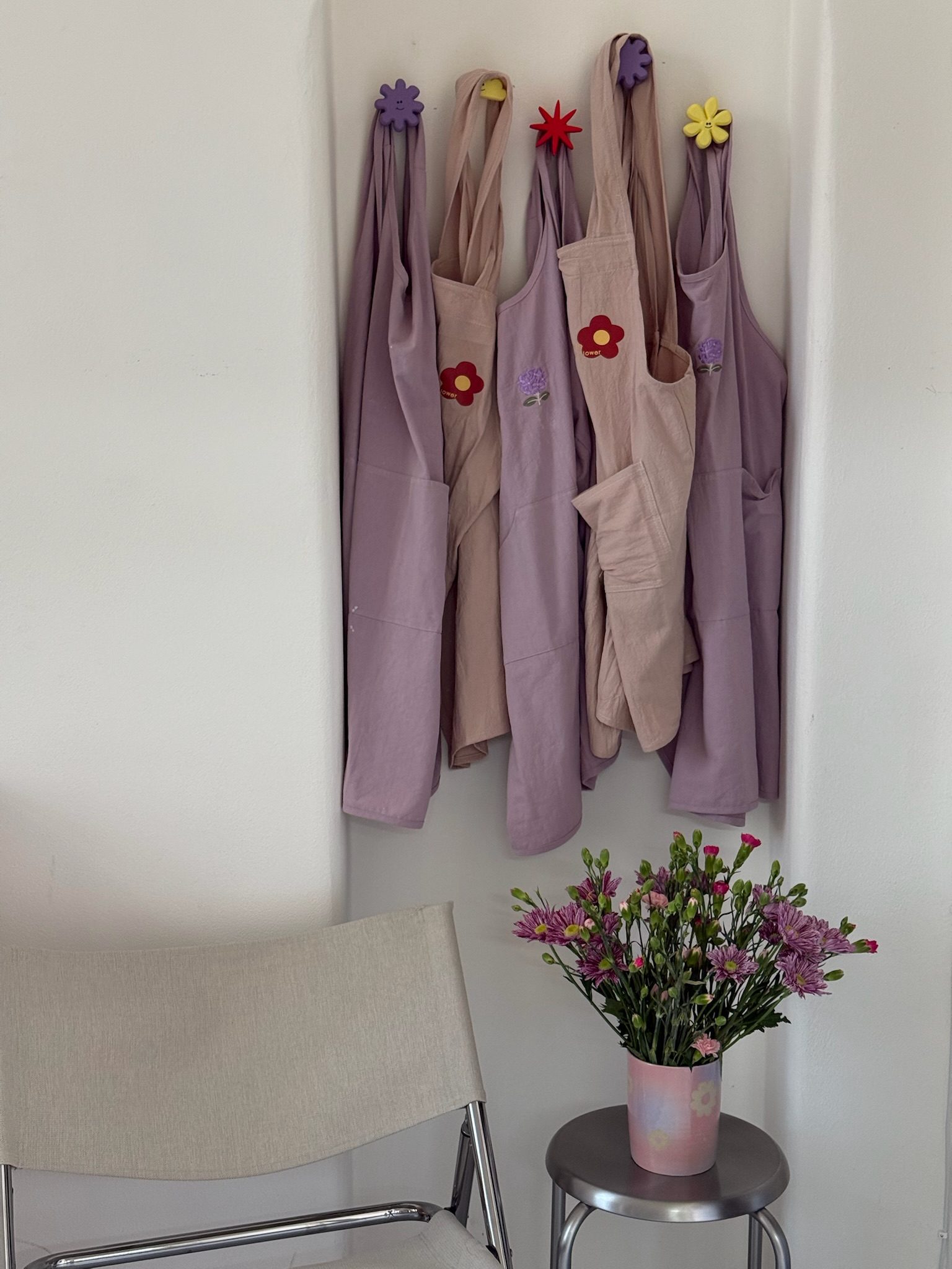 Aprons hanging in the Tocho studio